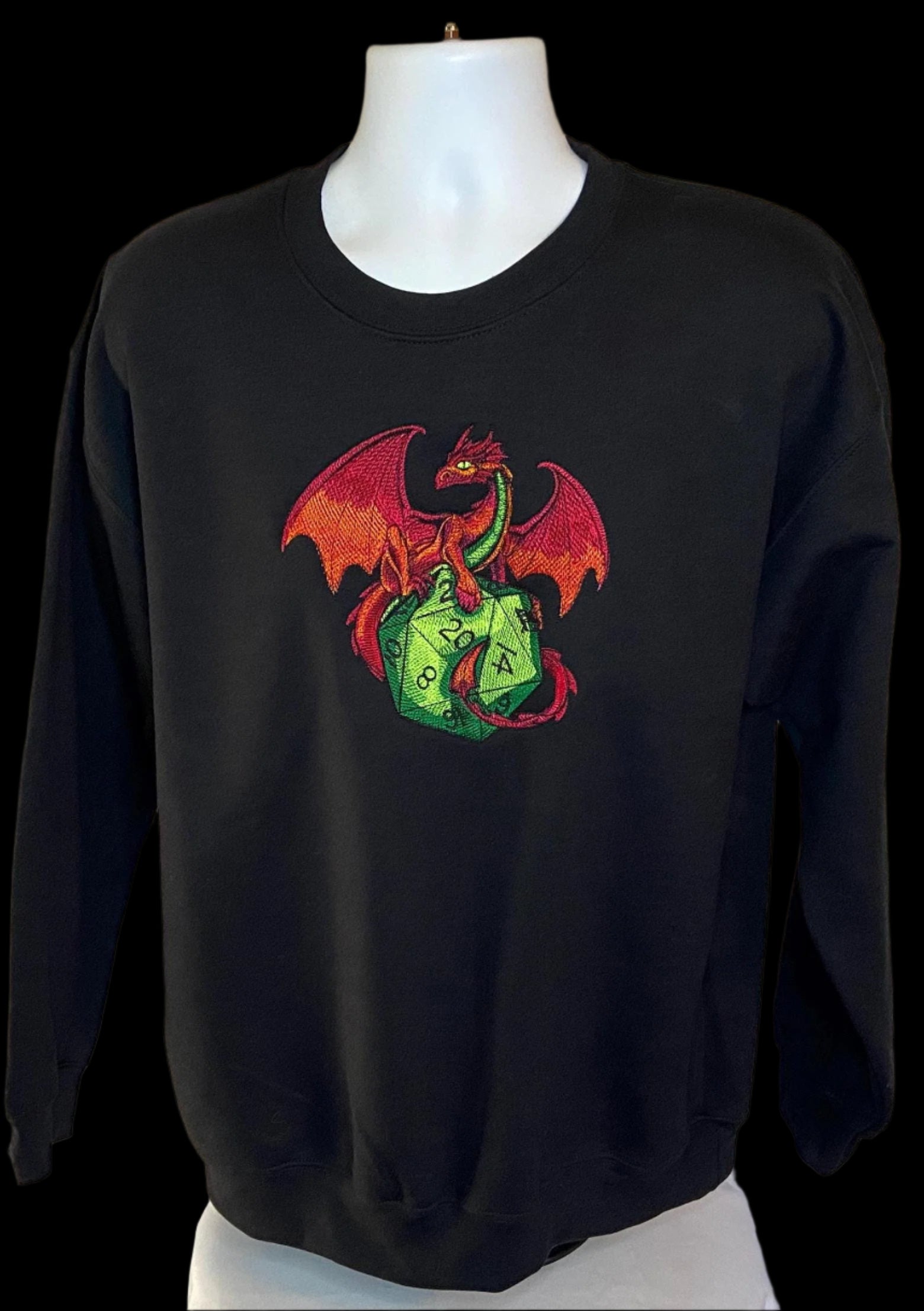 Black sweatshirt with a colorful dragon design on a mannequin against a white background