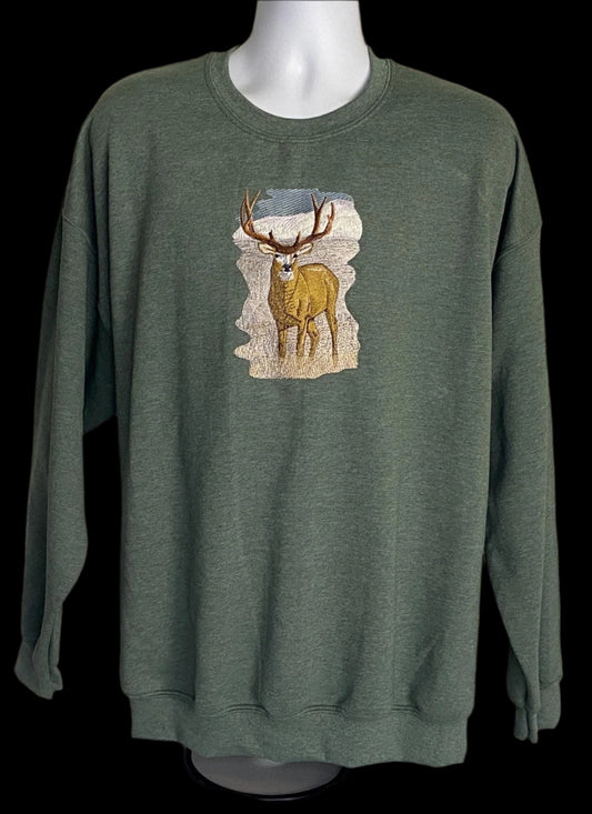 Green sweatshirt with a deer graphic on a mannequin against a neutral background