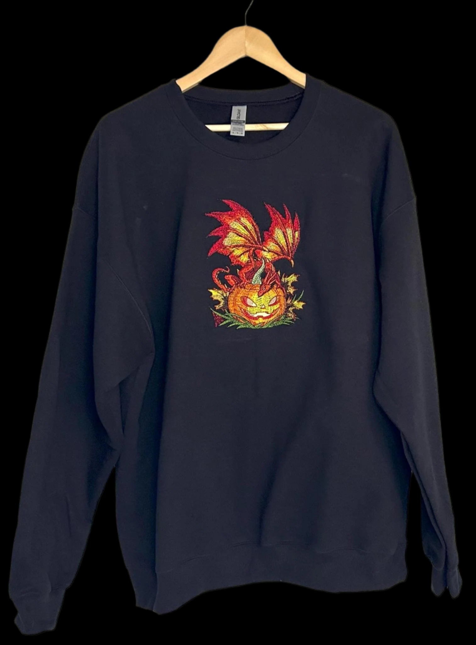 Black sweatshirt with a colorful dragon design on a white background